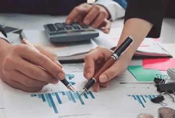 Accountants reviewing charts and business finance reports